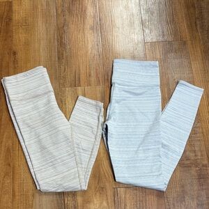 Athleta 2 pairs of Striped Leggings tan/cream and white/Light Blue size small